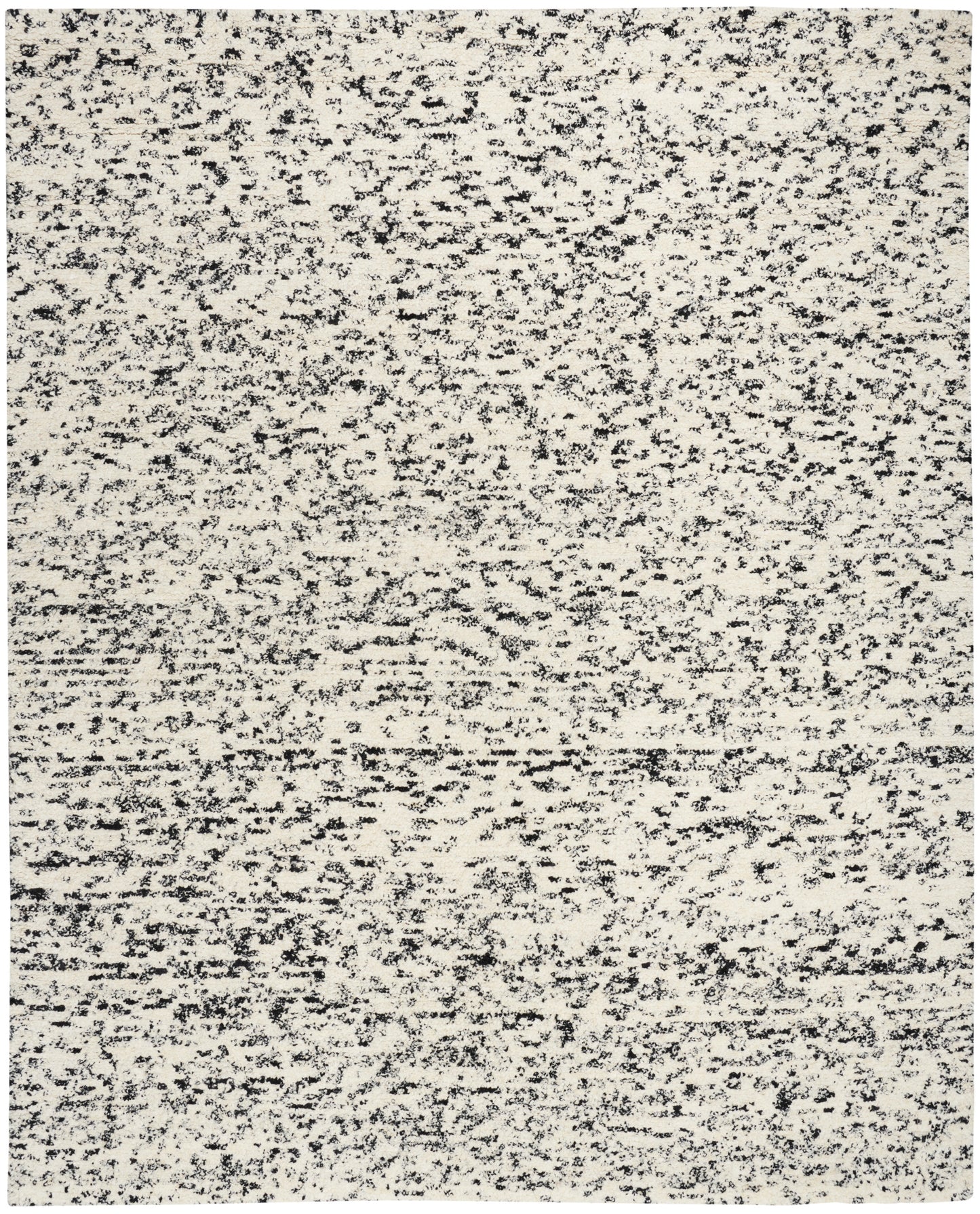 Rectangular beige speckled area rug with charcoal flecks; flat-weave, modern neutral rug.