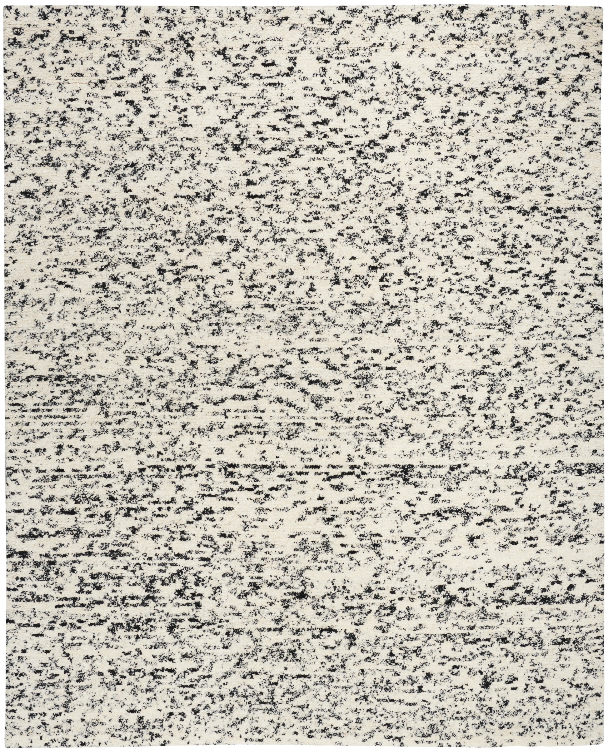 Rectangular beige speckled area rug with charcoal flecks; flat-weave, modern neutral rug.