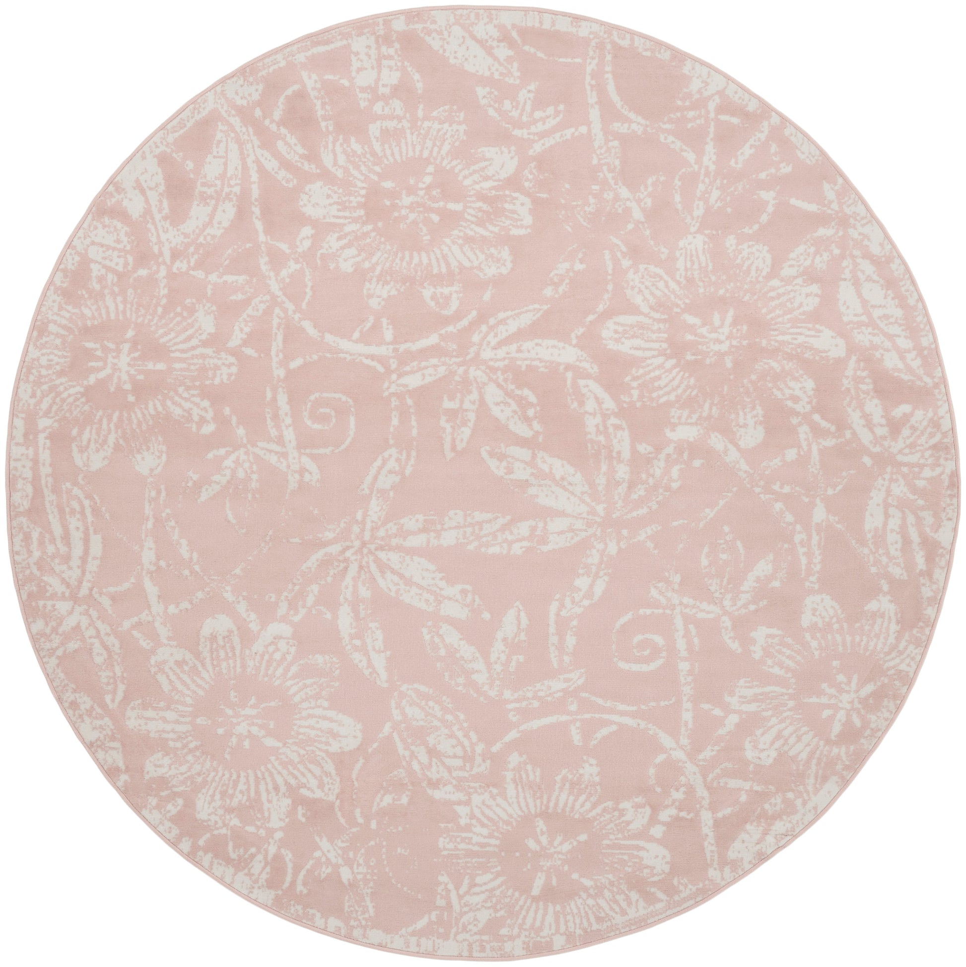 Circular pink rug with a white floral damask pattern.