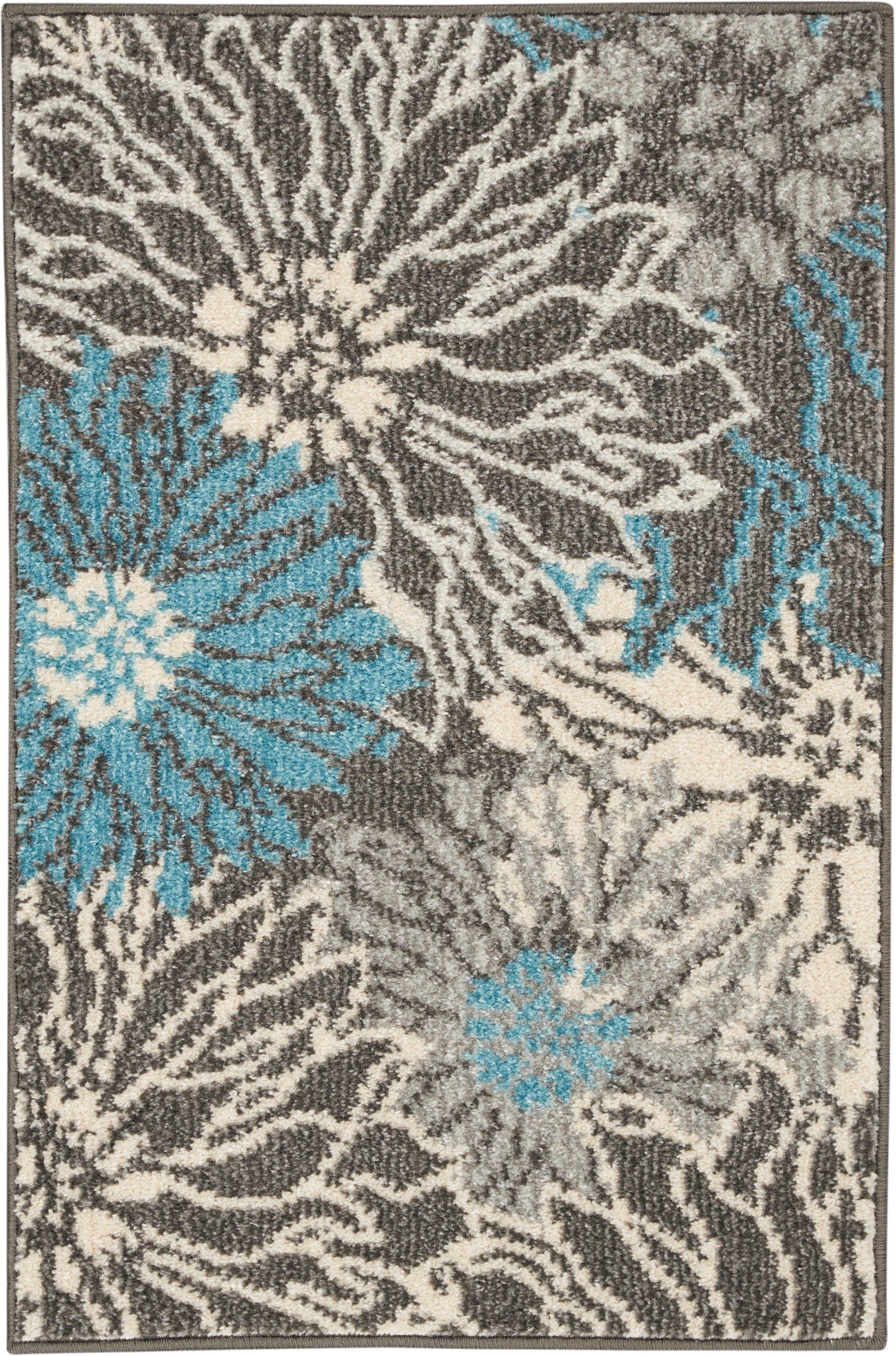 Plush gray rug with cream and teal abstract floral design, modern shag texture.