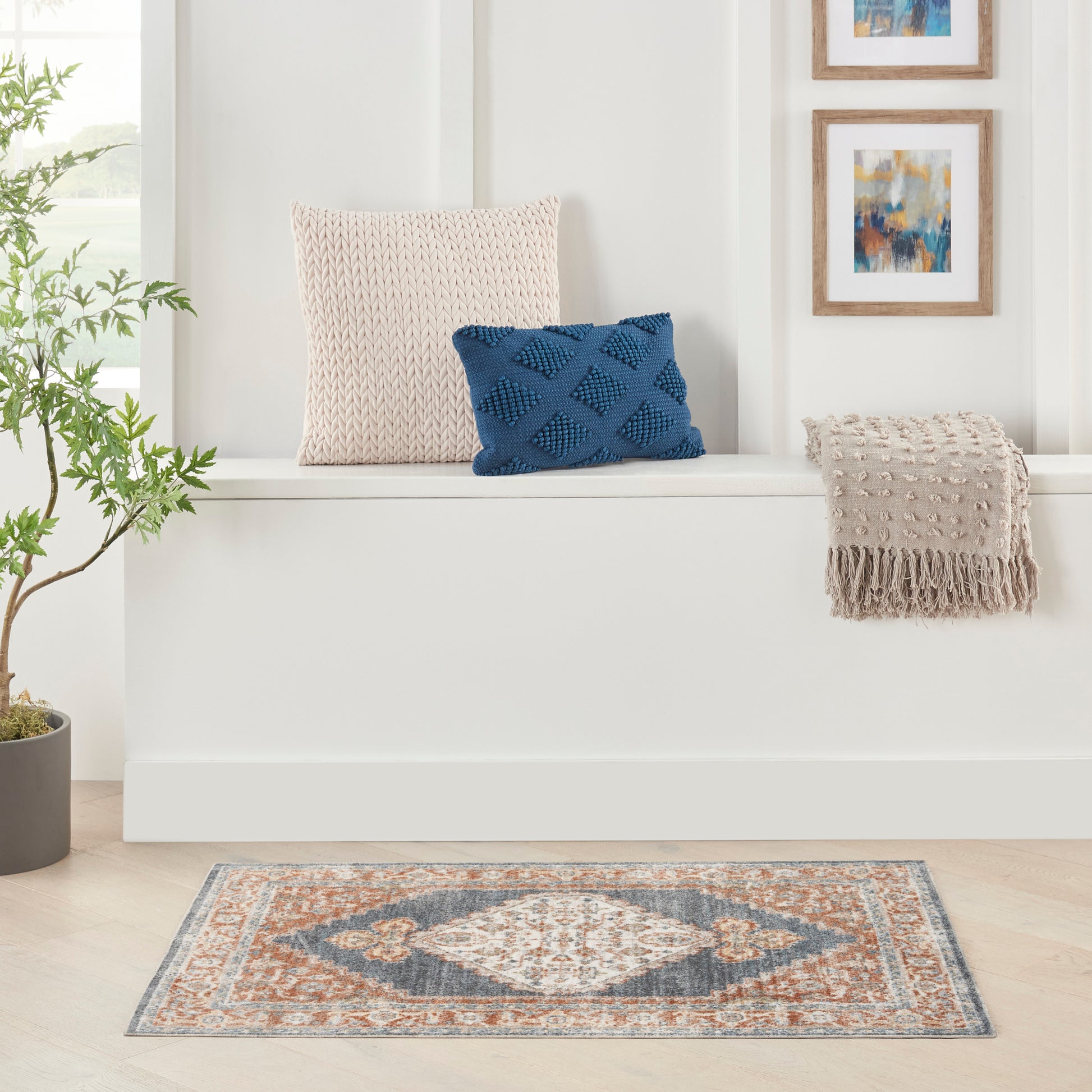 Orange-blue-gray vintage rug with a textured pattern.