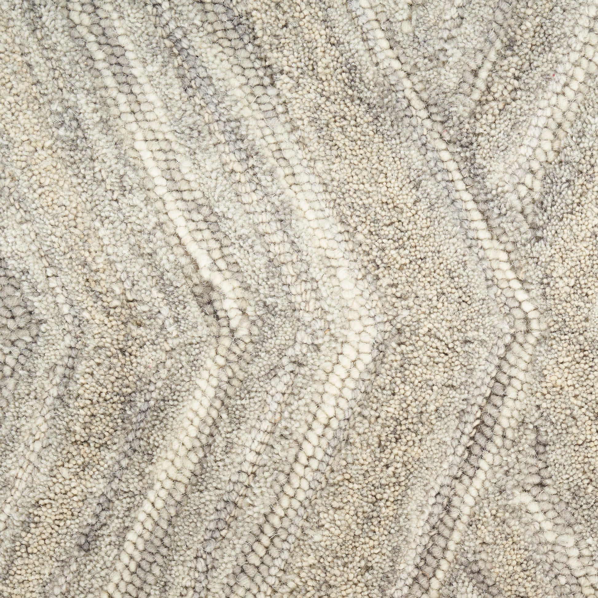 Neutral textured loop-pile rug in cream and taupe with chevron zigzag pattern.