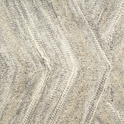 Neutral textured loop-pile rug in cream and taupe with chevron zigzag pattern.