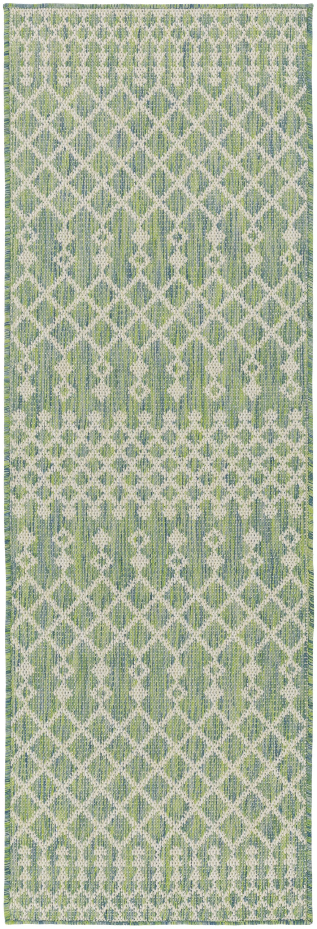 Green and white geometric woven runner rug with a diamond lattice pattern and fringe ends.