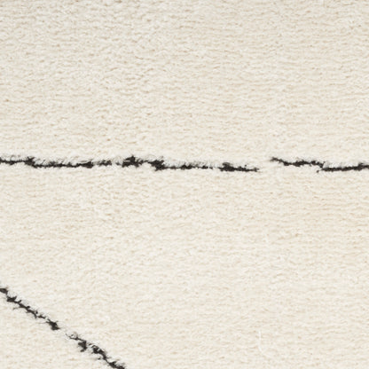 Cream shag rug with plush pile and thin black linear accents for a modern minimalist living room.