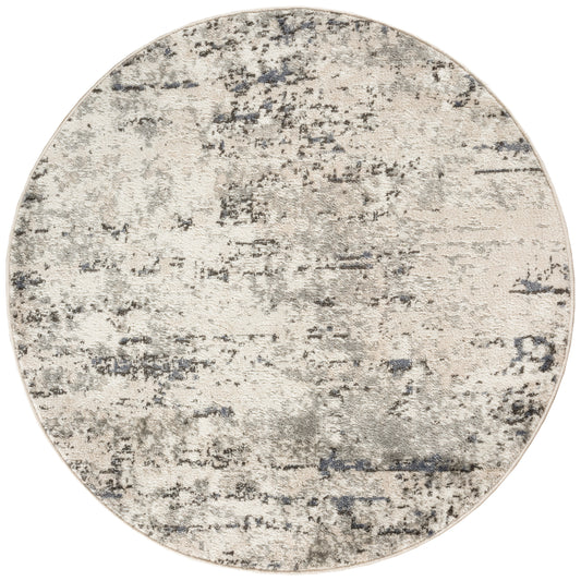 Round beige-gray abstract rug with a distressed mottled pattern and soft woven texture.