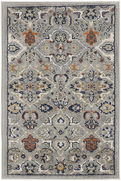 Gray-blue Bohemian-style rug with navy, ivory and orange floral medallions; plush machine-made living-room rug.