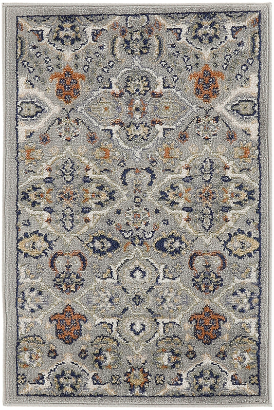 Gray-blue Bohemian-style rug with navy, ivory and orange floral medallions; plush machine-made living-room rug.