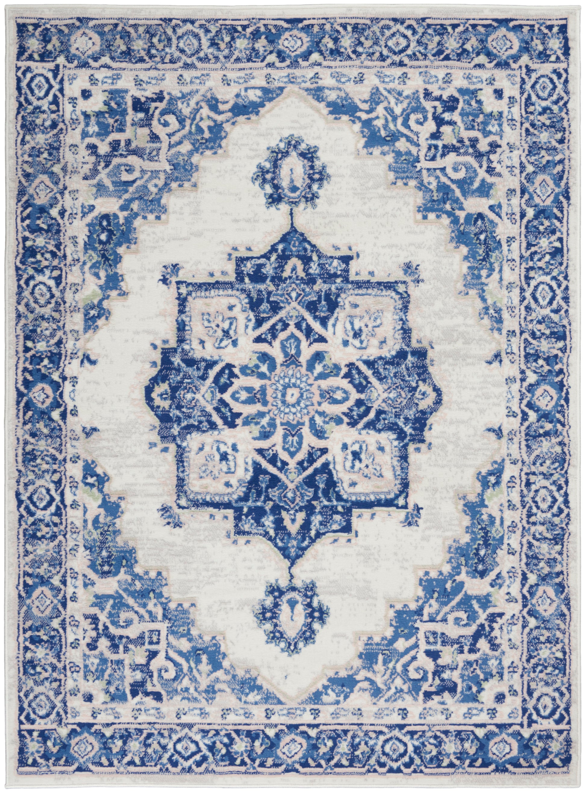 Blue and white oriental area rug with a central star medallion, intricate floral border, rectangular for living room decor.