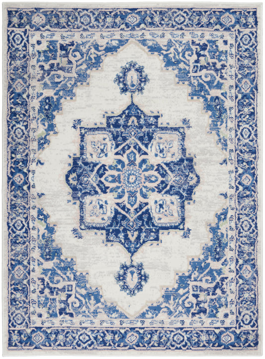 Blue and white oriental area rug with a central star medallion, intricate floral border, rectangular for living room decor.