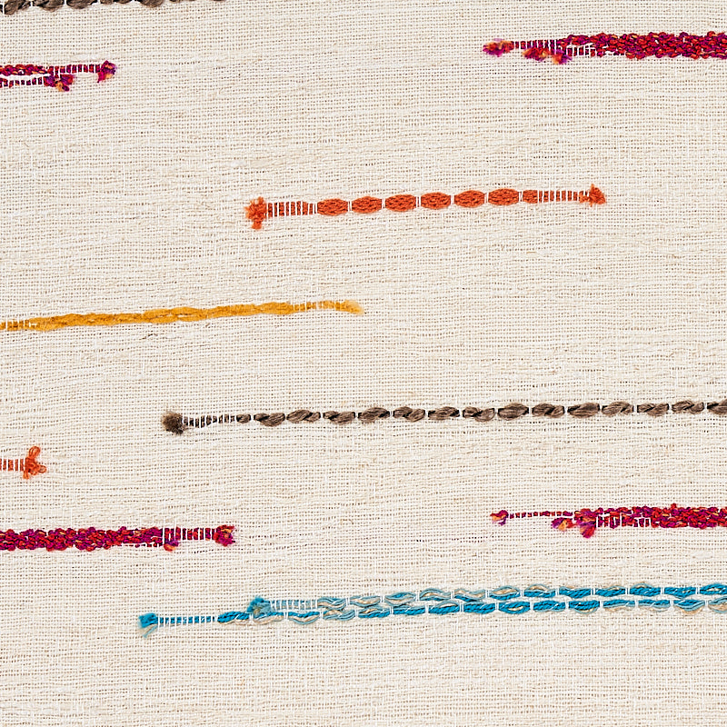 Beige woven fabric with thin multicolor embroidered lines across, in orange, yellow, brown, pink, purple and blue.