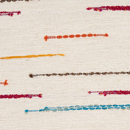 Beige woven fabric with thin multicolor embroidered lines across, in orange, yellow, brown, pink, purple and blue.
