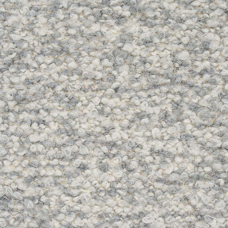Grey and ivory speckled loop-pile carpet texture with bouclé look, soft and durable for living areas.