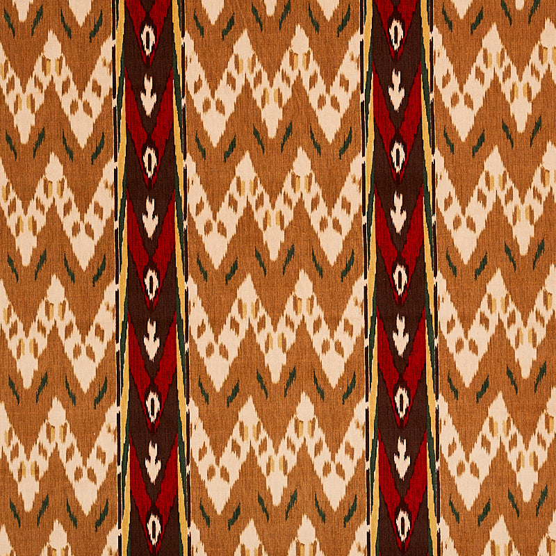 Aztec/tribal patterned fabric with tan & brown diamonds, white chevrons, & dark red vertical stripes.