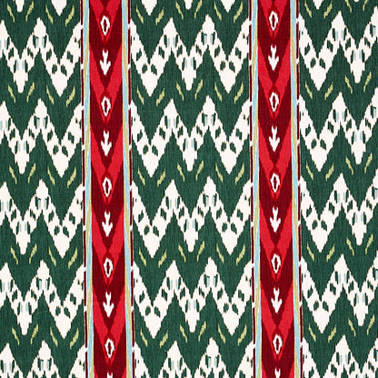 Woven textile with green and white zigzag diamond pattern and two bold red vertical stripes.