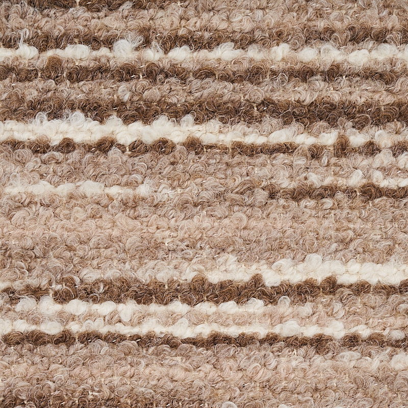 Close-up of a beige and brown striped woven rug with a looped pile texture.