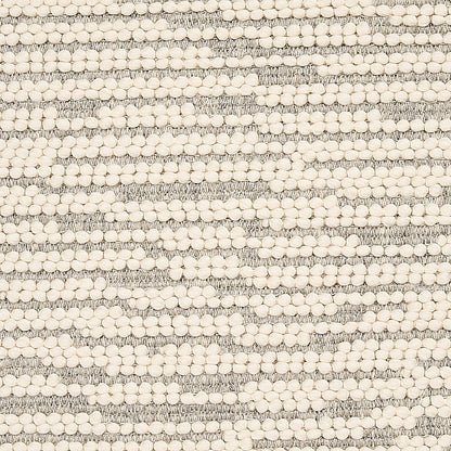 Cream pom-pom beads arranged in horizontal stripes on gray textured woven fabric; boucle-style textile for throws or cushions