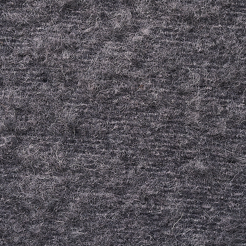 Charcoal gray heather wool felt fabric close-up with soft, fuzzy fibers.