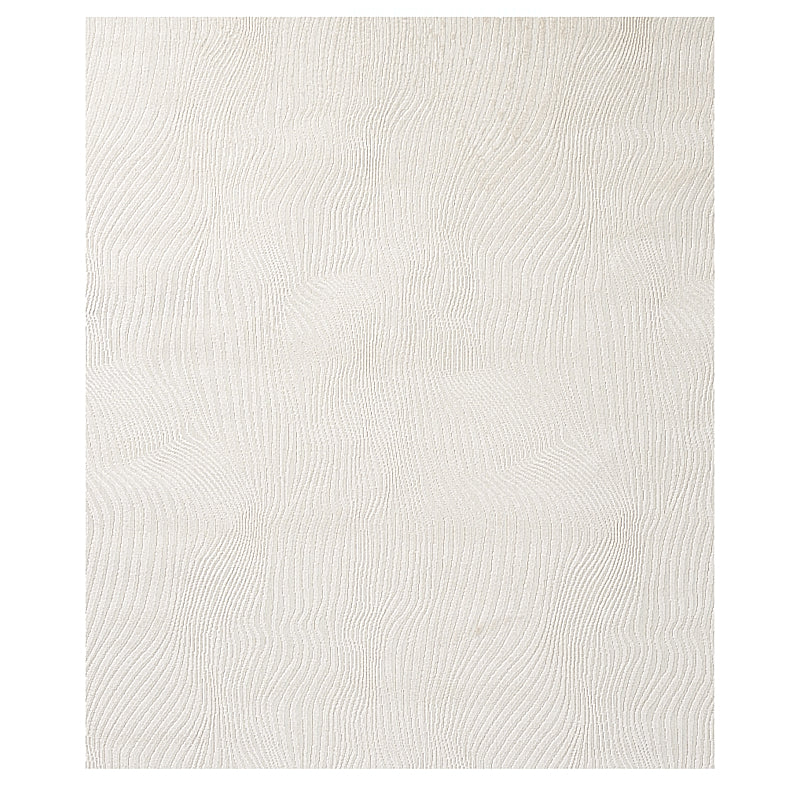 Cream textured rug with subtle wavy rib pattern, rectangular shape, ideal for living room or bedroom.