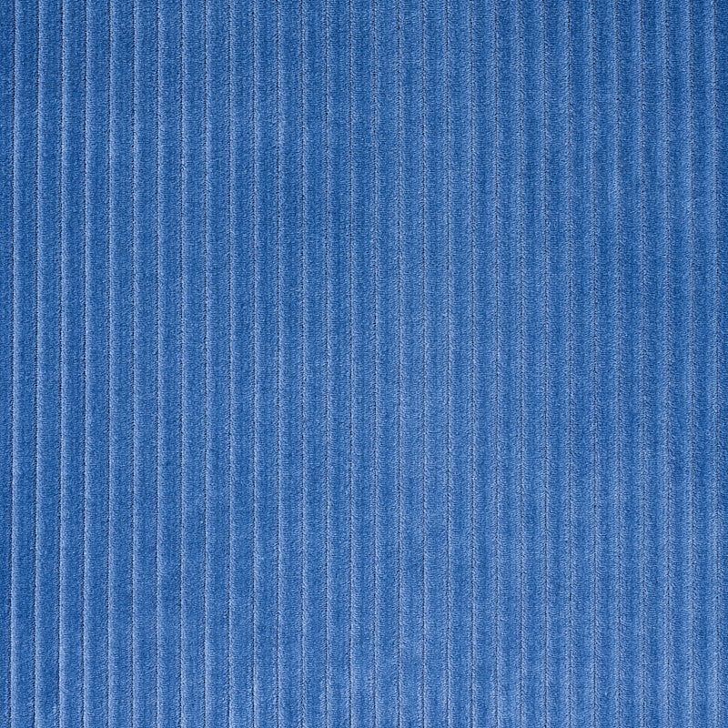 Blue corduroy fabric close-up with vertical ridges (wales) and soft texture.