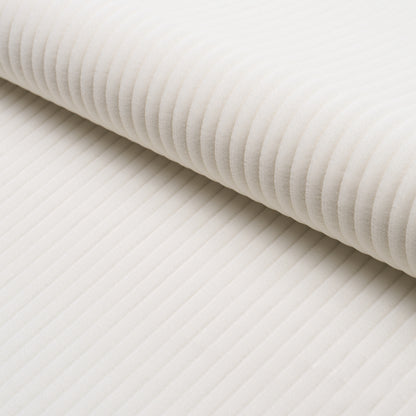 Cream-white ribbed fabric roll with soft corduroy-like texture; versatile for upholstery or apparel.