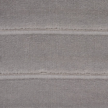 Close-up of Otter Grey channeled velvet fabric with plush nap and subtle horizontal ridges.