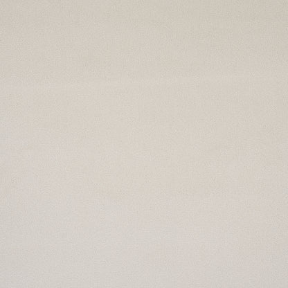 Beige textured fabric backdrop with subtle speckled grain, neutral canvas-like surface.
