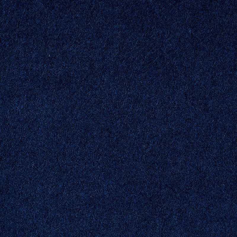 Deep navy blue velvet-like fabric texture close-up.
