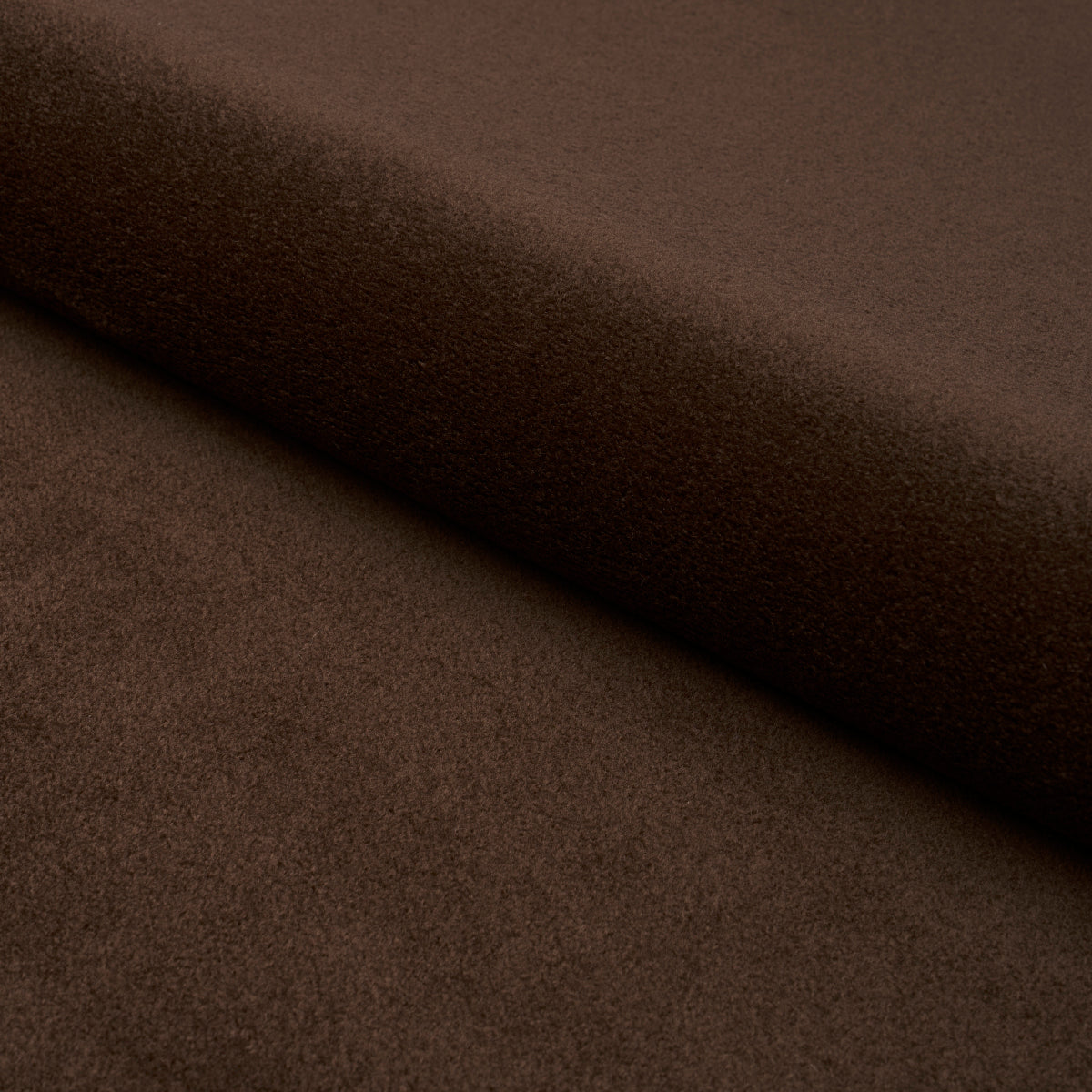 Brown suede-like fabric roll with soft, matte texture and gentle folds.