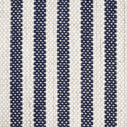 Beige woven fabric with narrow navy blue vertical stripes & textured upholstery weave.