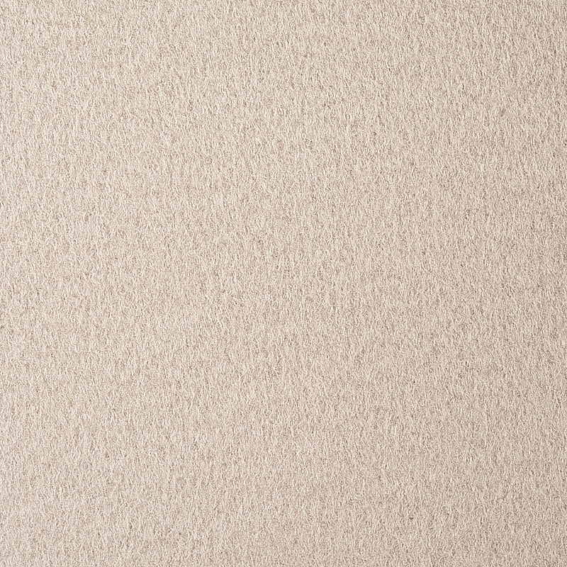Beige suede-textured fabric surface with soft nap, neutral warm background.