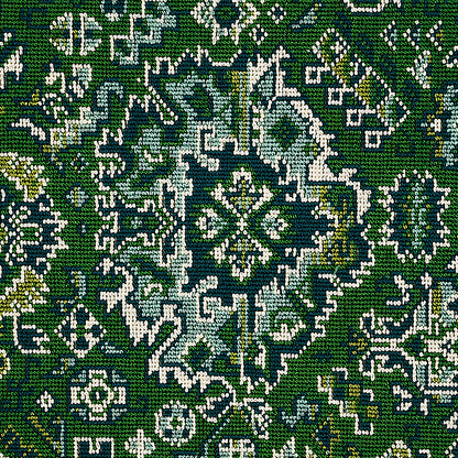 Green woven rug with white and blue ornate medallion pattern and oriental floral motif.