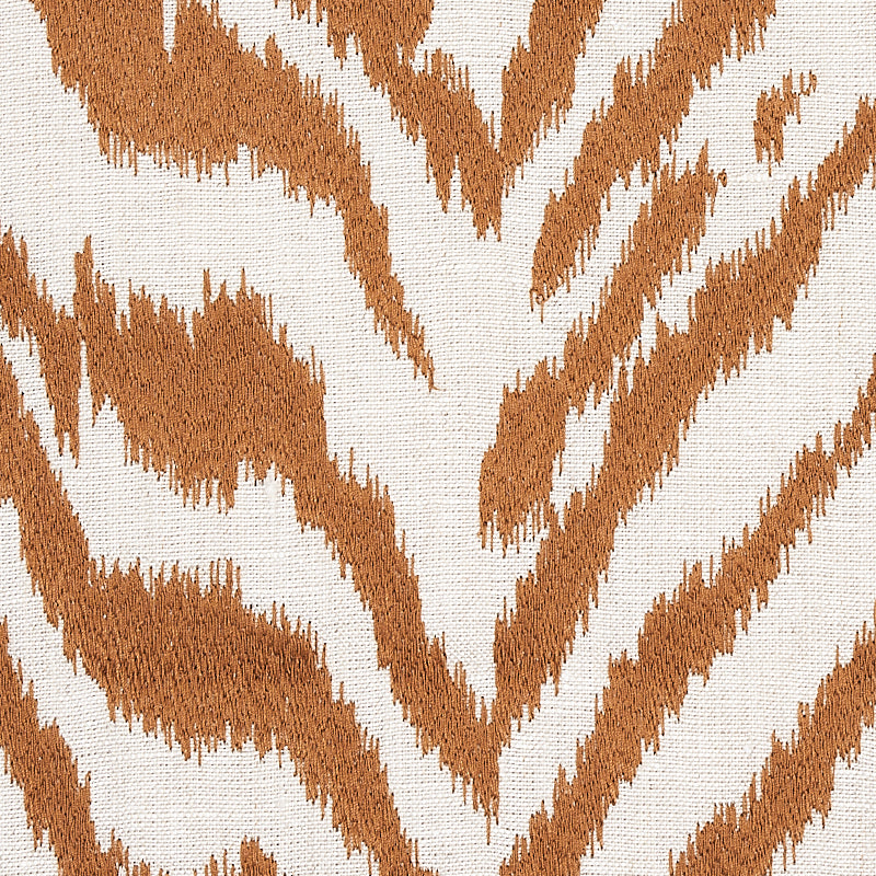 Brown tiger-stripe pattern on light beige woven fabric; bold abstract animal print.