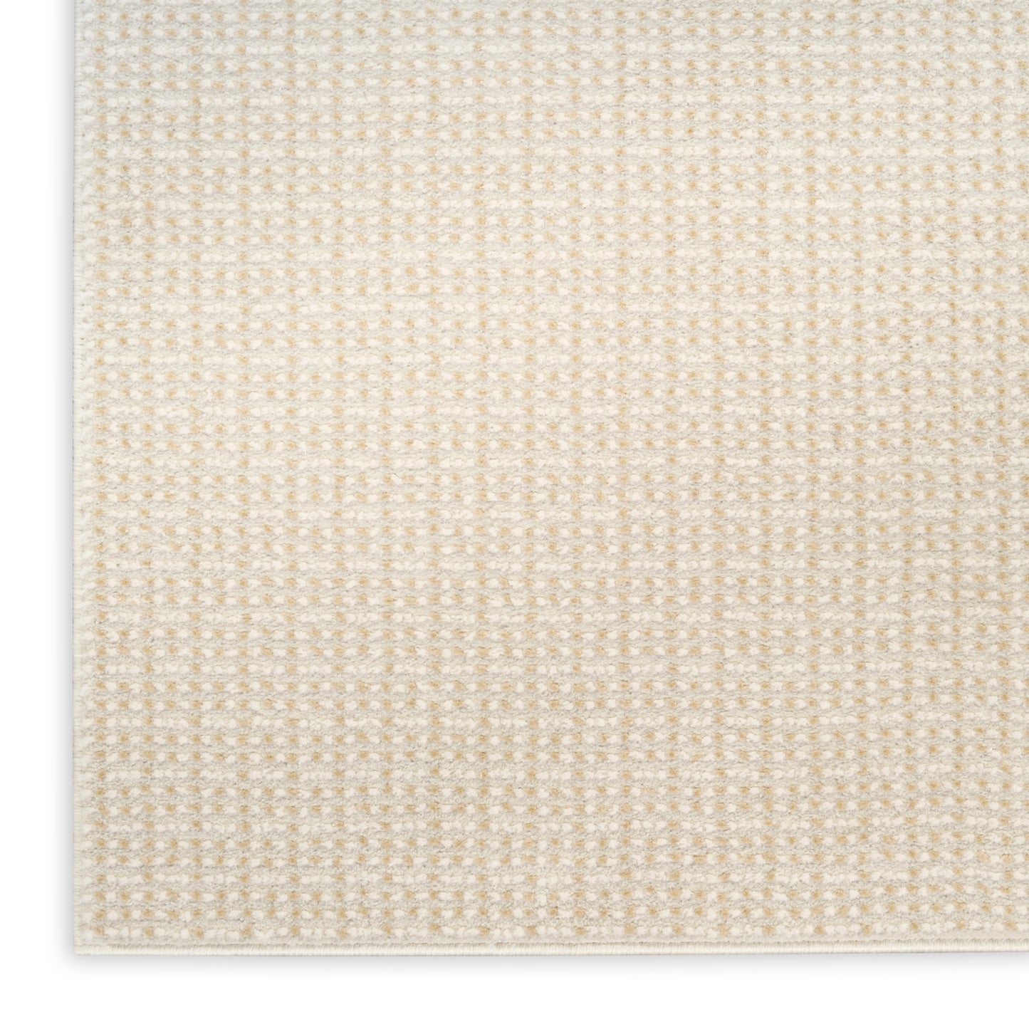 Beige woven rug close-up with subtle grid pattern and white edge.