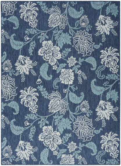 Blue floral damask rug with white and light-blue blossoms and vines; rectangular home decor.