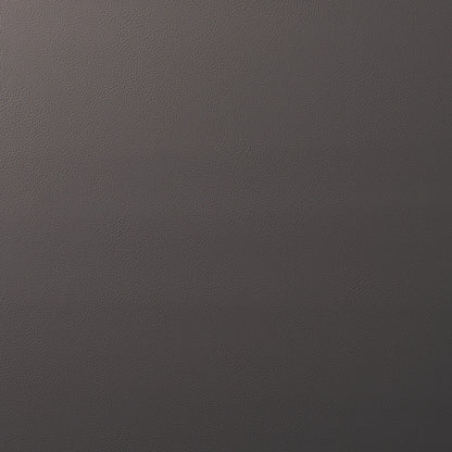 Close-up of brown pebbled leather with a subtle gradient from warm brown to dark charcoal.