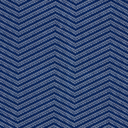 Blue woven fabric with white dashed chevron pattern; versatile textile for apparel or home decor.