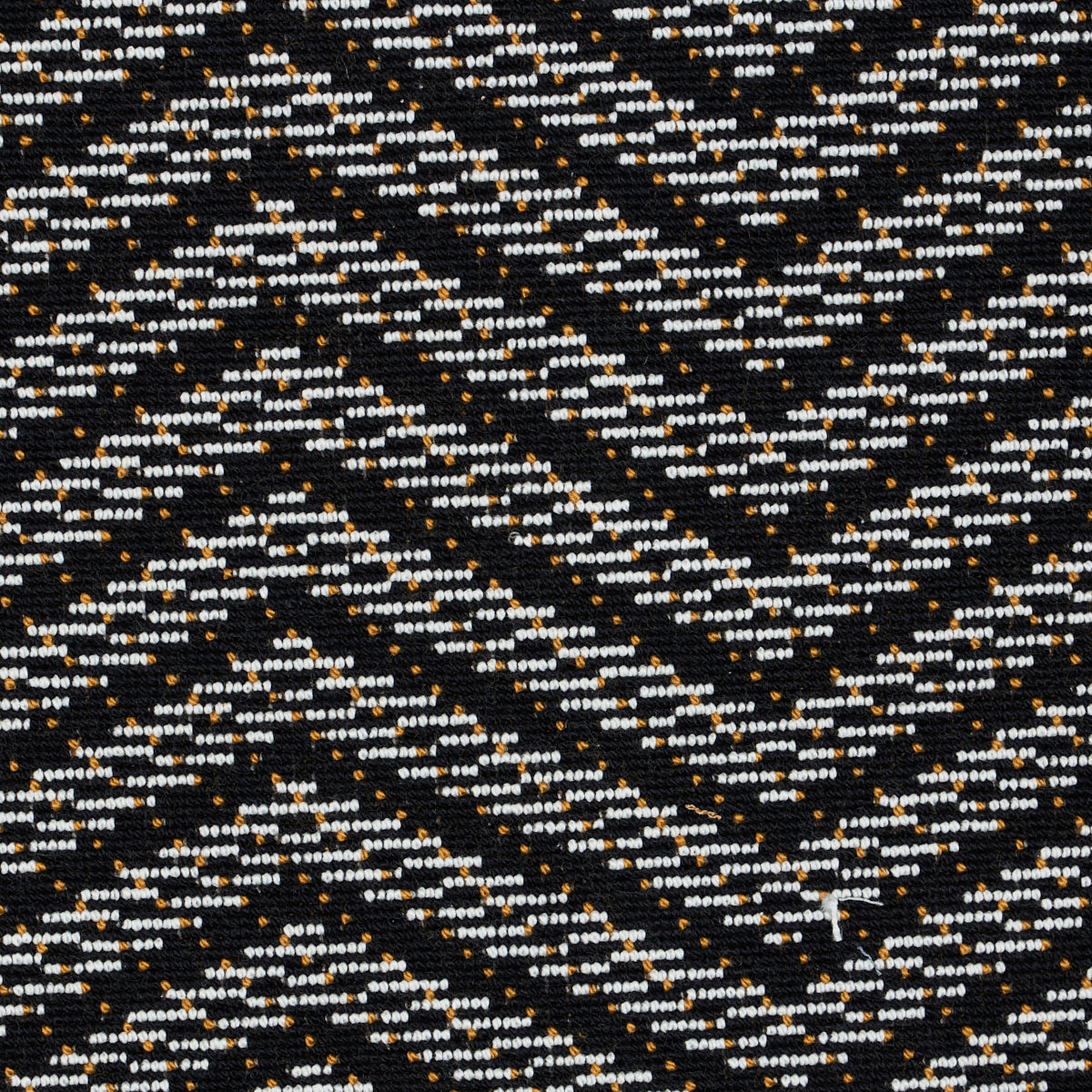 Black fabric with white and gold speckled zigzag chevron pattern.