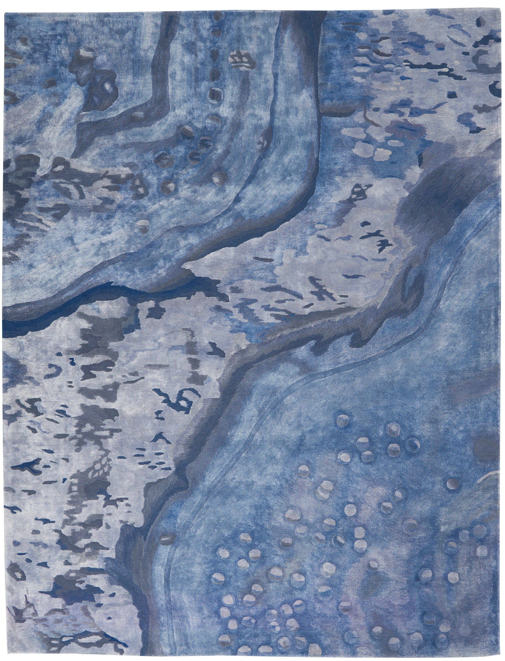 Blue abstract rug with water-like swirls and dotted clusters in cool ocean tones; modern decorative piece.