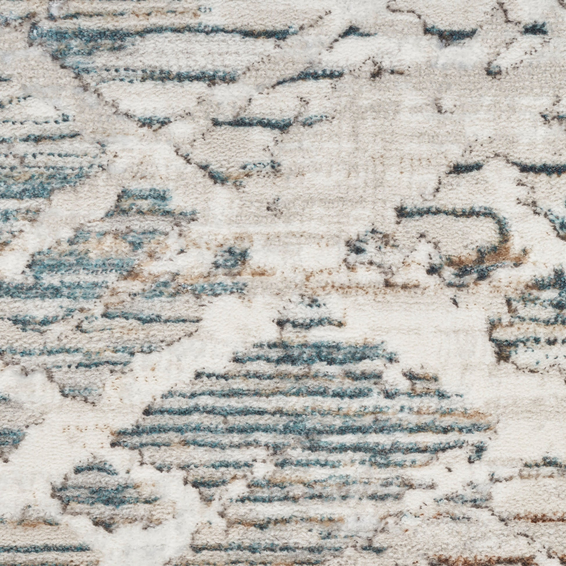 Distressed ivory rug with blue-gray geometric pattern; modern Moroccan-inspired design and soft textured surface.