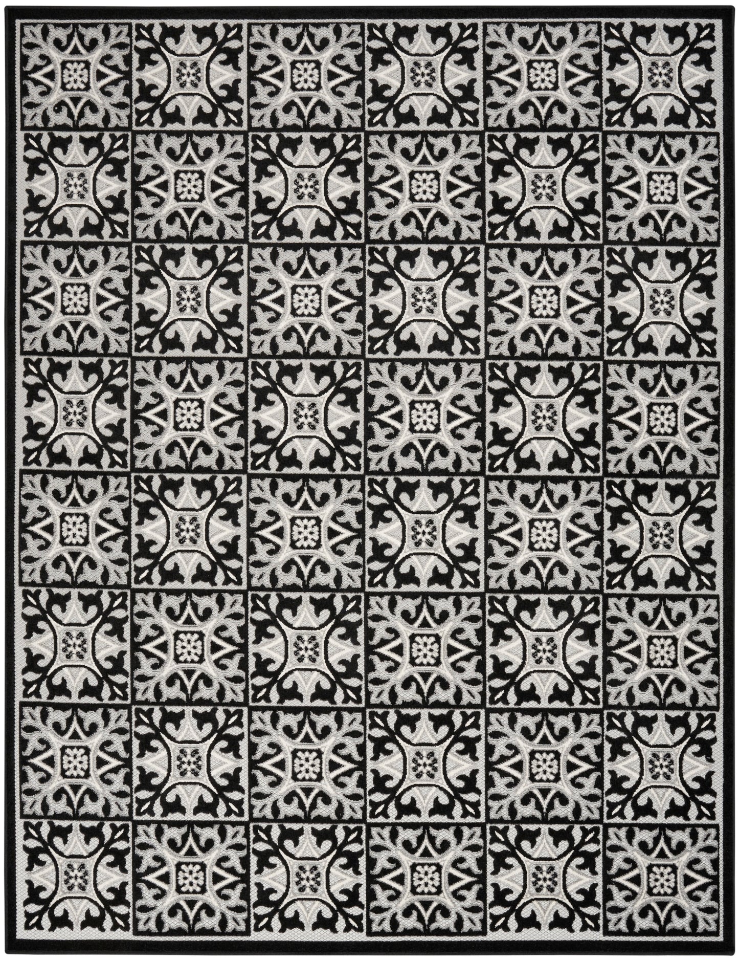 Black & gray bordered area rug with repeating square tile motifs featuring ornate floral scrollwork.