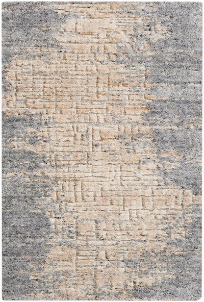 Beige and gray distressed rug with abstract geometric pattern and plush pile.