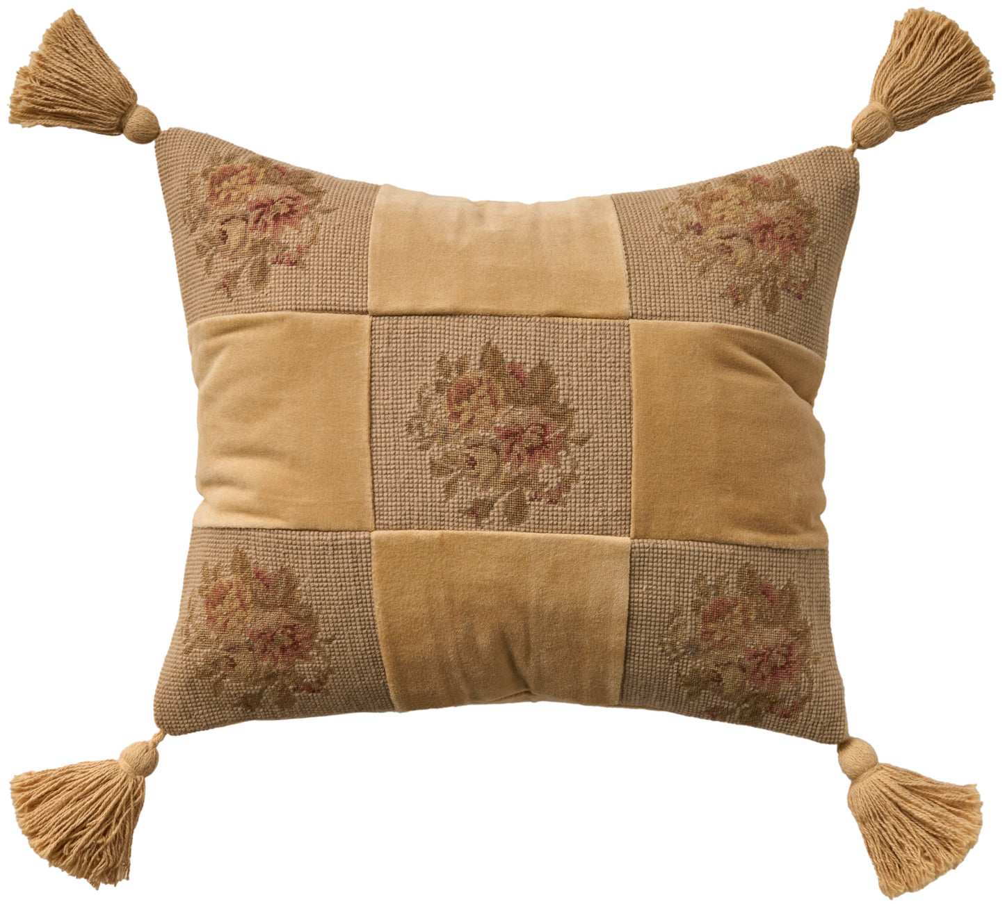 Beige rectangular patchwork pillow with floral jacquard panels and tassels at each corner.