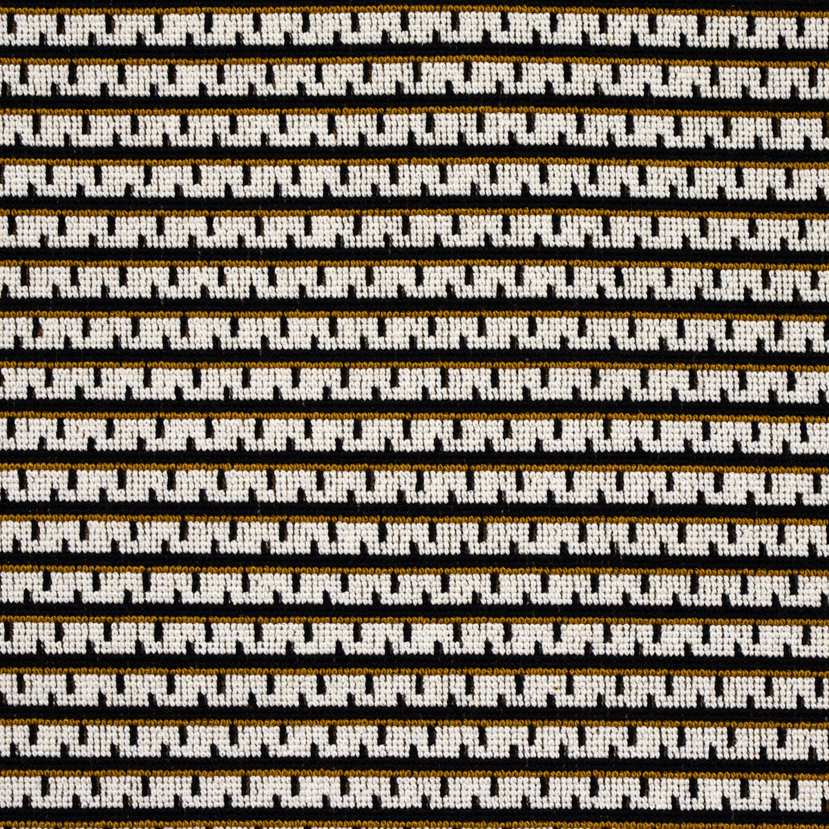 Close-up of white fabric with repeating brown-and-black geometric link pattern in horizontal stripes.