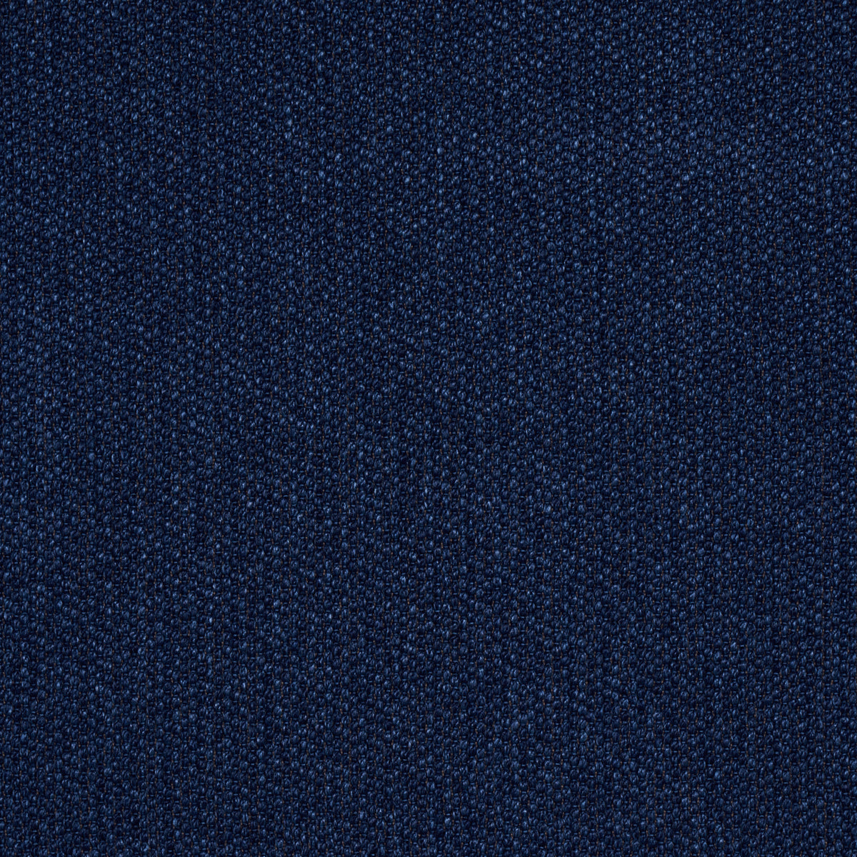 Close-up of dark indigo indoor/outdoor textured fabric with visible weave.