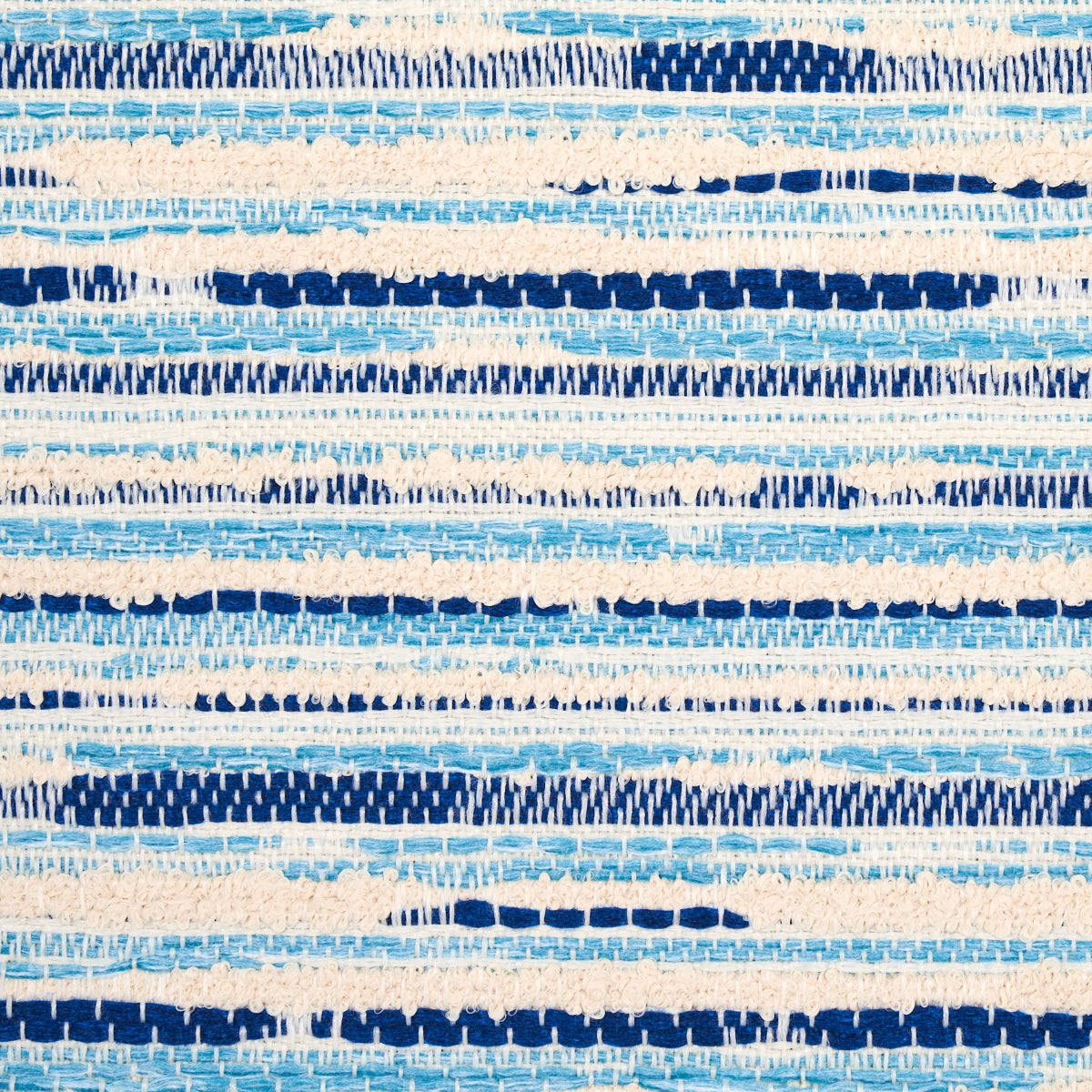 Blue, navy and cream striped indoor/outdoor fabric with irregular painterly bands.