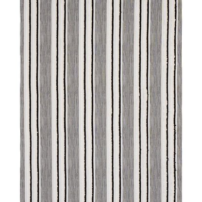 Vertical striped rug with black & gray lines on white; modern woven textile for living room decor.