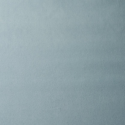 Light blue-gray textured fabric surface with a soft suede-like finish.
