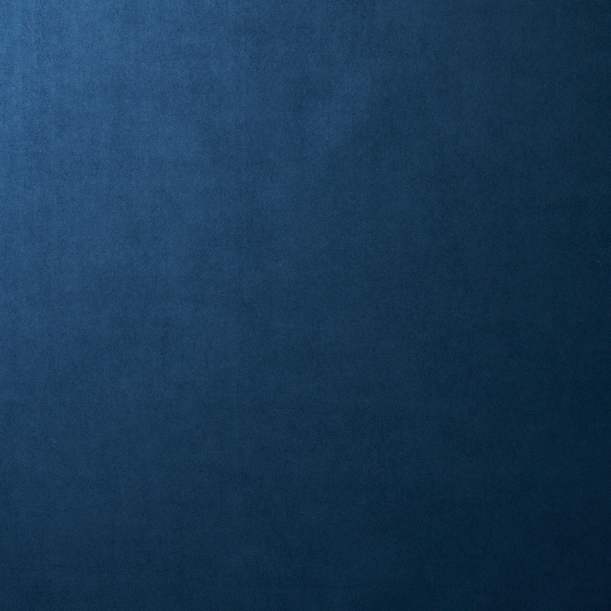 Dark blue velvet texture with subtle grain, rich navy shade for upholstery or fashion.