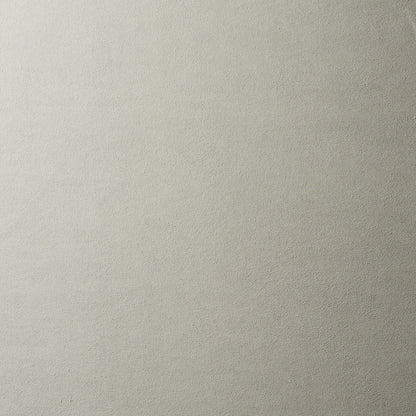 Neutral light gray textured wall backdrop with a subtle gradient and matte finish.